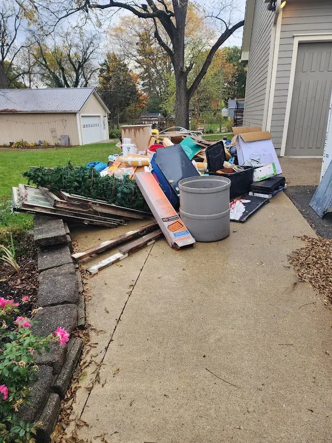 Dumpster being loaded with debris for 12 Yard Dumpster Rental in Arthurtown